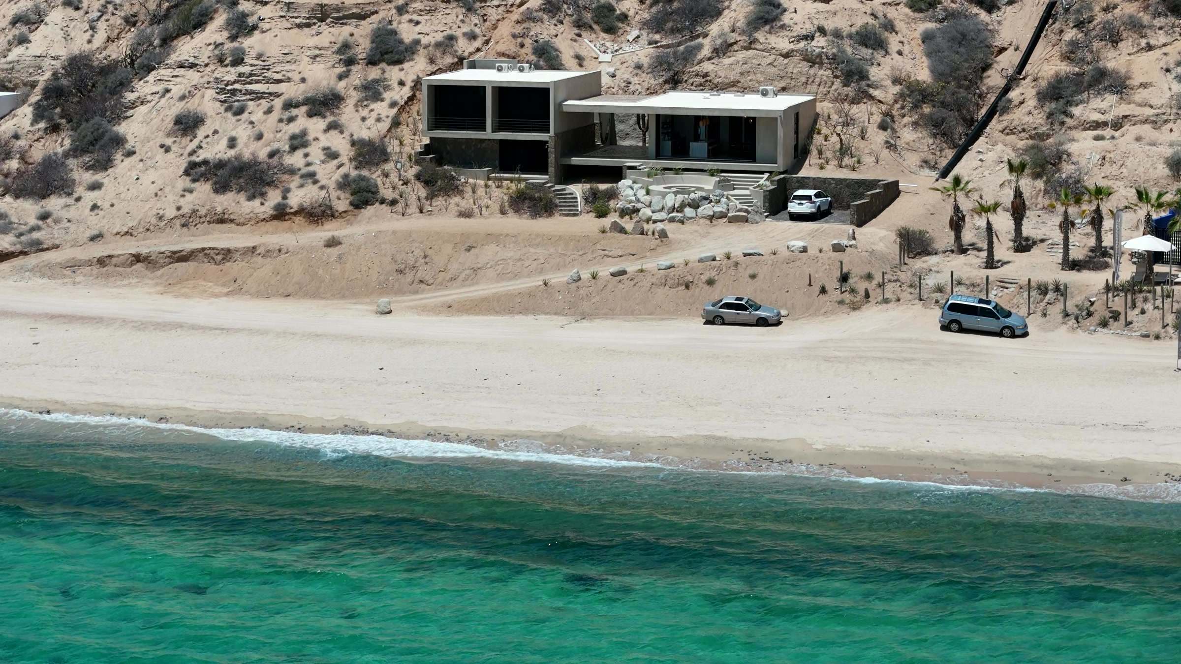 Beach Haus from the water, with the beach and the bay in front of it.