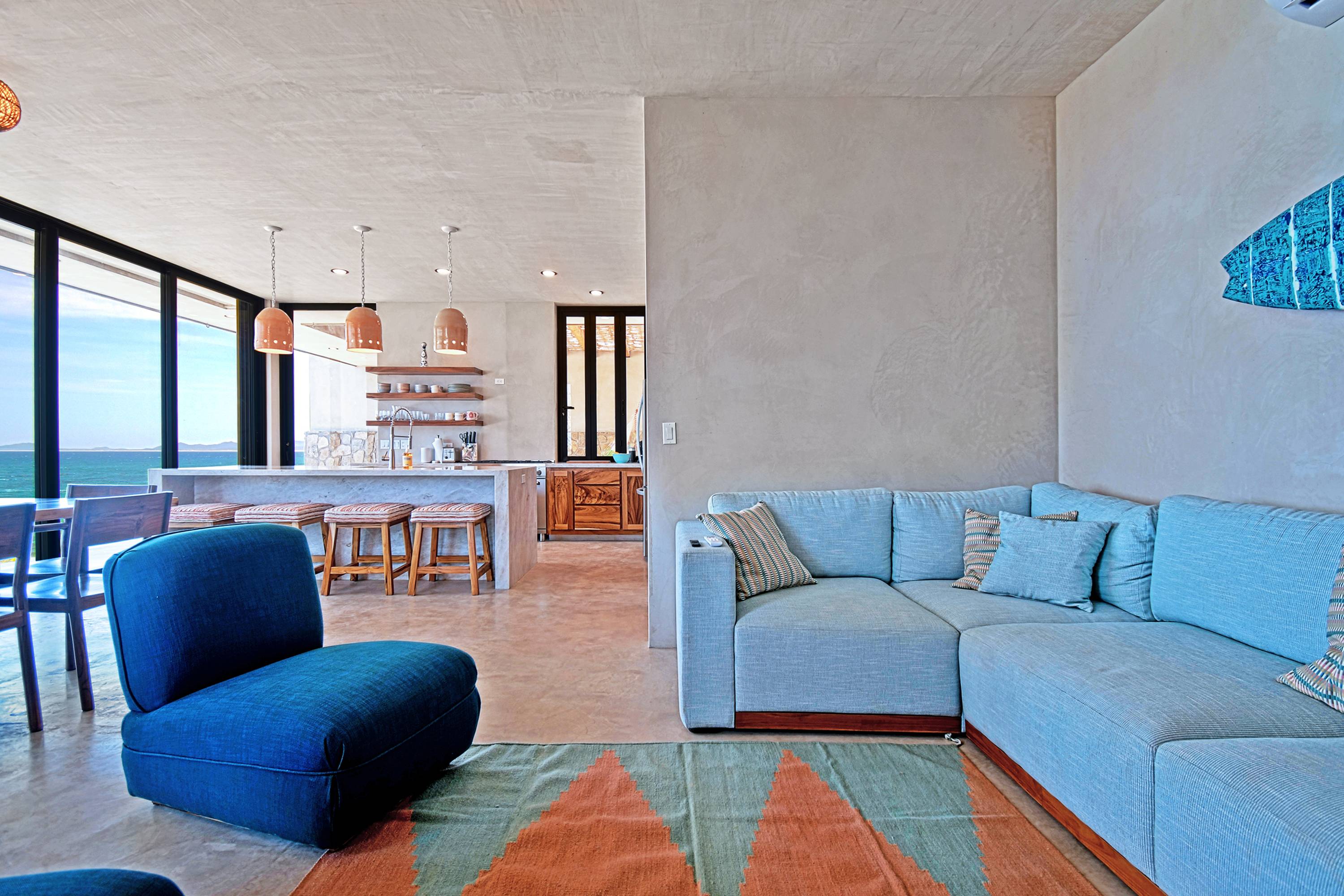 The sitting area, with the kitchen and dining table beyond.