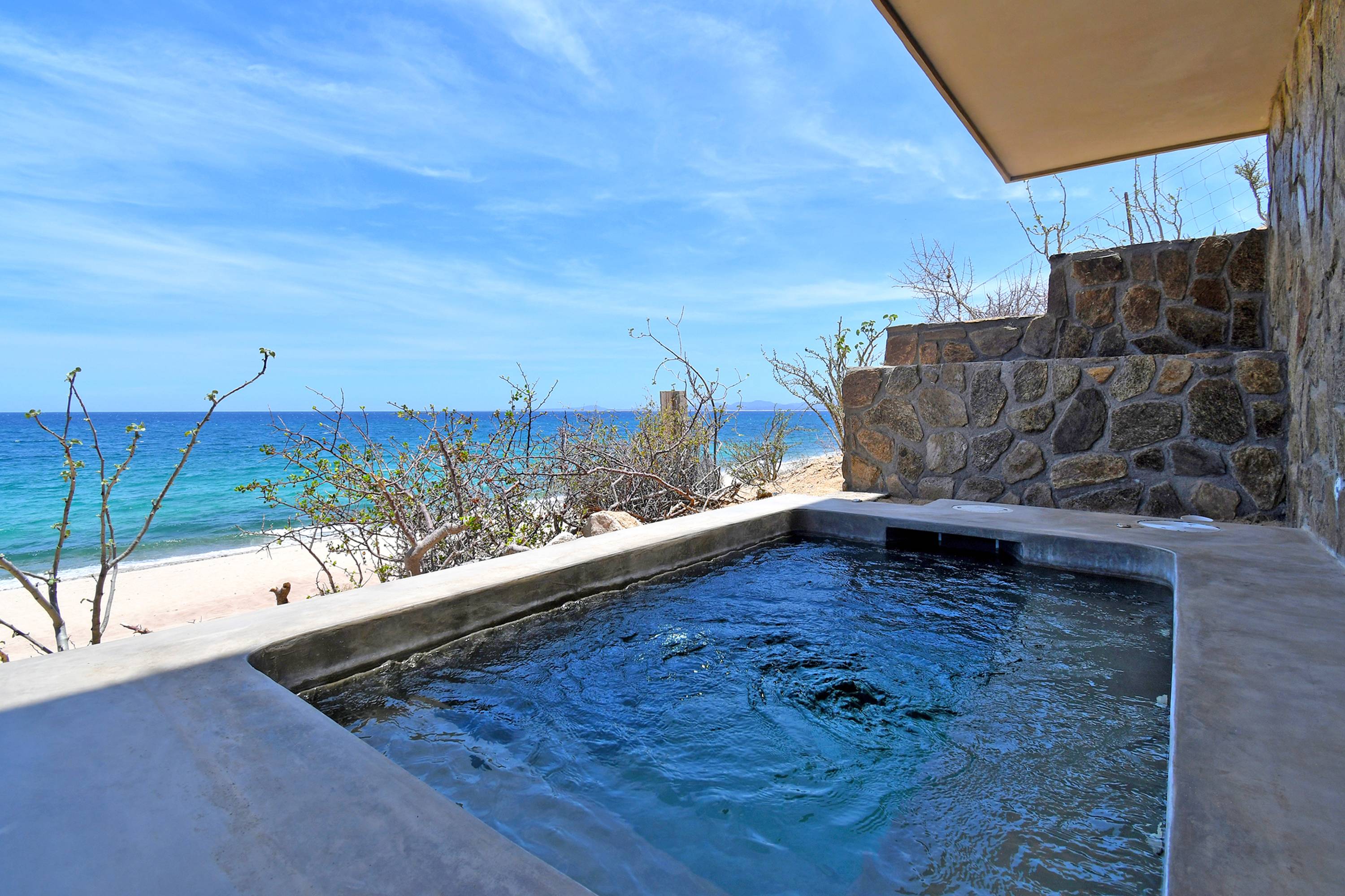 The plunge pool, with the beach and the water past it.